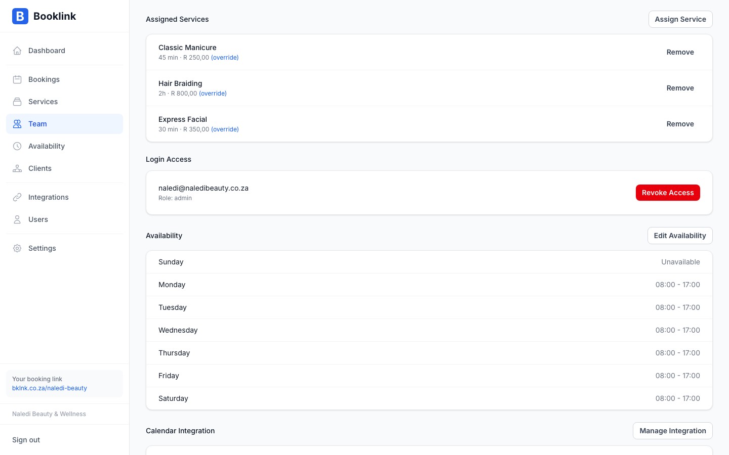 The assigned services tab on a team member profile showing a list of services with optional overrides